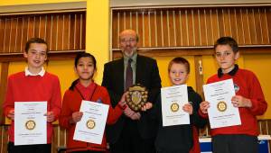 The winning team Kirkcudbright receive their certificates and shield from President Dr John Locke